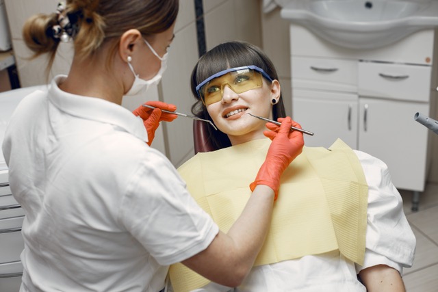 Dentist examining a patient in a dental chair
