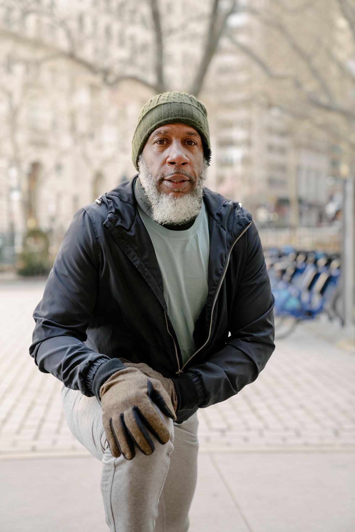 Older man stretching outdoors in a park